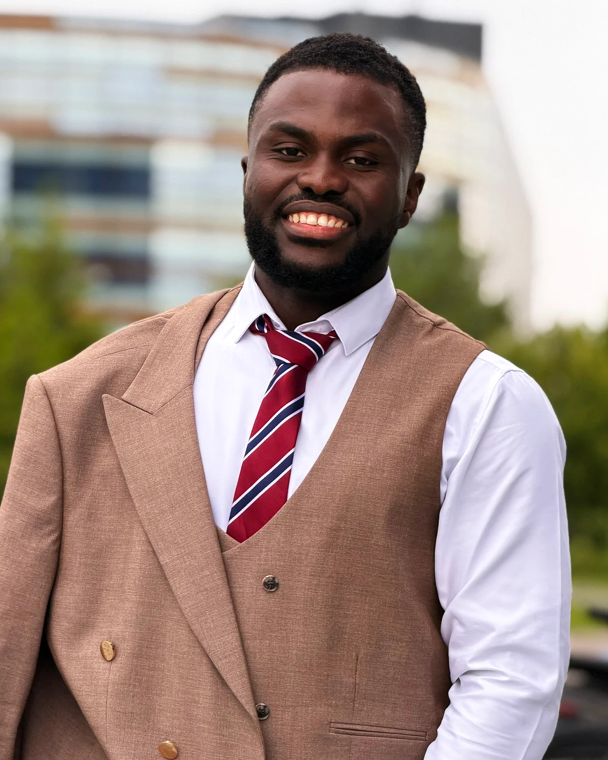 Okore Joel Chidike, photographed outdoors.